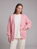 Women's pink chunky knit cardigan with buttons, long sleeves and patch pockets